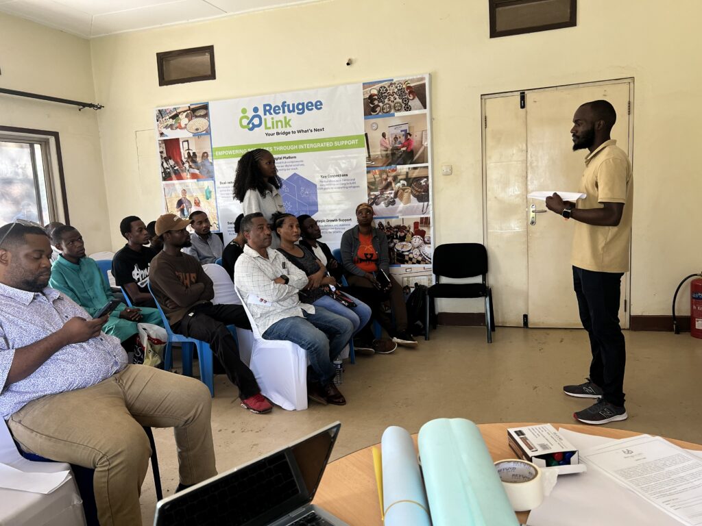 RefugeeLink's Leon addressing attendees of an FGD that was hosted at their premises