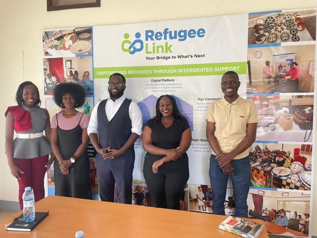 Group photo of representatives from RefugeeLINK and the Next Creator Programme following a partnership exploration meeting on youth empowerment, digital skills, and creative economy opportunities in Kampala.