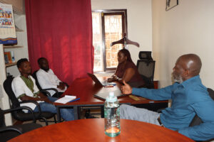 RefugeeLink staff and consultants at a meeting