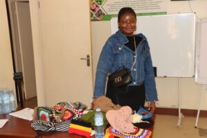 DR Congo native displaying her knitted fabrics