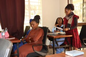 RefugeeLink's Flavia addressing event attendees